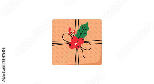 A beautifully wrapped brown gift box adorned with a festive holly and berry decoration, tied with twine, perfect for Christmas and holiday celebrations.