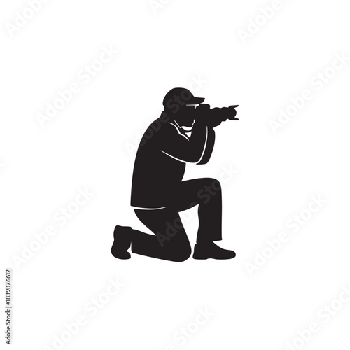 Professional Photographer Silhouette Capturing Action Shot Outdoors with Camera in Hand and Hat, Kneeling to Get Best Angle on White Background