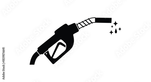 A black fuel nozzle dispensing gasoline with sparkling effects a striking visual silhouette