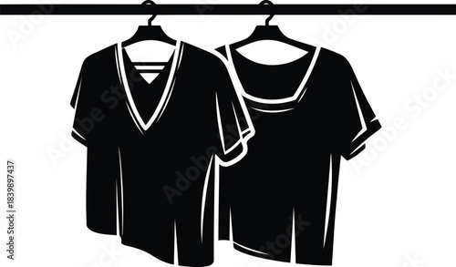 Black T shirts hanging on hangers on a rack t-shirt