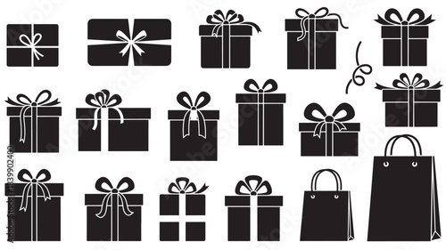 Collection of black gift boxes and bags with ribbons and bows on
