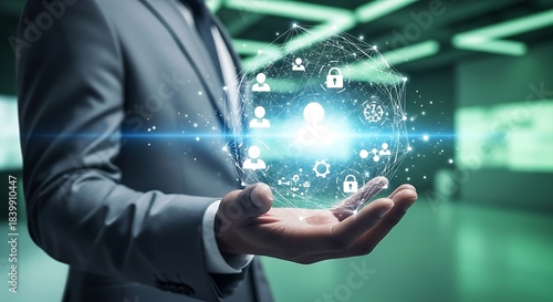 Man in suit holding glowing digital network with people icons and locks technology connection