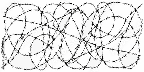 A tangled mass of black and white barbed wire creating a complex pattern