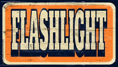 Aged and worn flashlight sign on wood