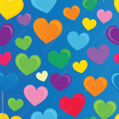 Seamless pattern of scattered colorful hearts on green.
