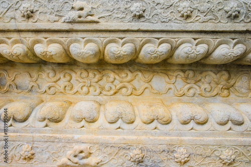 Vintage ornament on the stone. Close-up seamless texture. Stone texture. Embossed pattern.