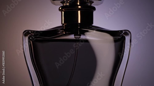 Elegant Black Perfume Bottle on a Gradient Background.