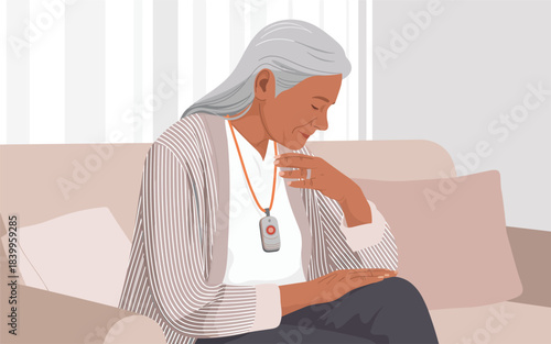 Woman sitting on couch looking at pendant on necklace