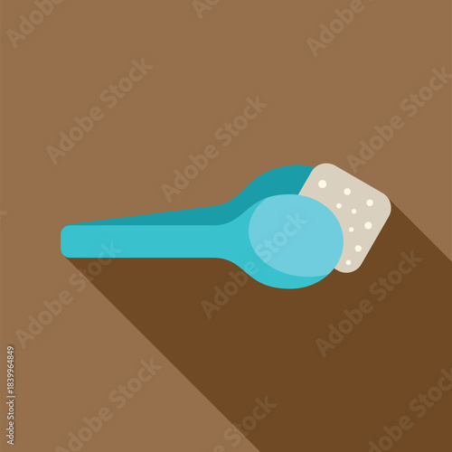 Blue spoon holding a white sugar cube with long shadow