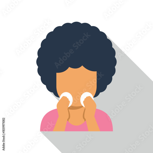 Woman with afro hair performing her daily facial cleansing ritual with cotton pads