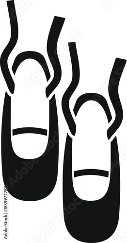 Ballet pointe shoes hanging, representing classical dance and professional performance