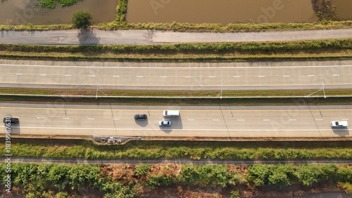 Aerial view of street in Bangkok Thailand with cars and countryside