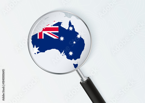 Australia Map Under Magnifying Glass with National Flag Overlay.