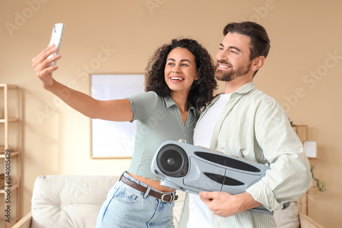 Young couple with boombox t...