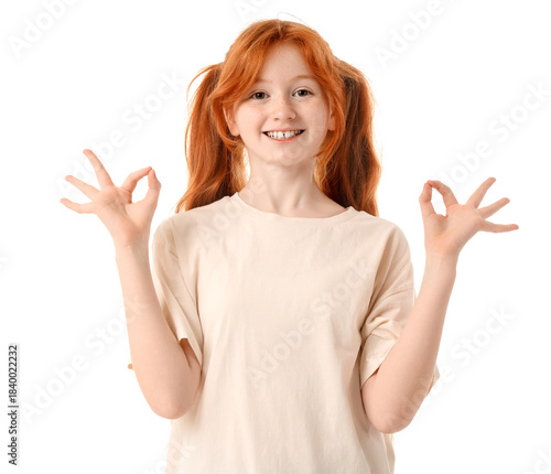 Teenage redhead girl showin...