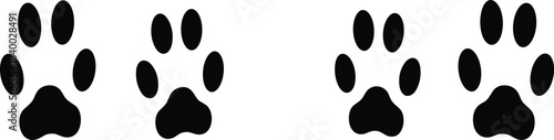 High-contrast black vector silhouette set of four animal paw prints or tracks, ideal for pet themes, veterinary design, wildlife, and tracking graphics