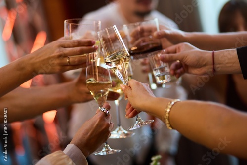 Fotografie Hands Raising Glasses at Party Celebration
