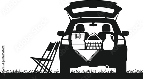 Black silhouette of an open car trunk filled with picnic items and chairs on grass open trunk basket