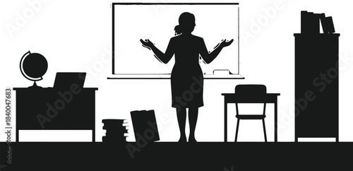 Silhouette of a teacher gesturing in a classroom with desk globe laptop and books education teaching