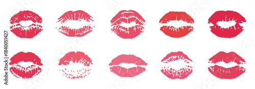 Set of ten feminine lips imprints in shades of red and pink on white background