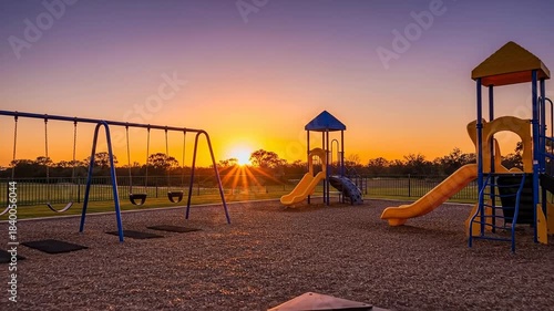 Playground at Sunset - A Serene and Colorful Scene.