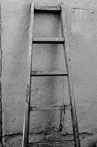 Old ladder leaning against the wall