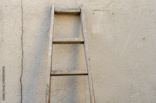 Old ladder leaning against the wall