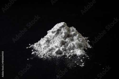 Creatine Powder Pile on Black