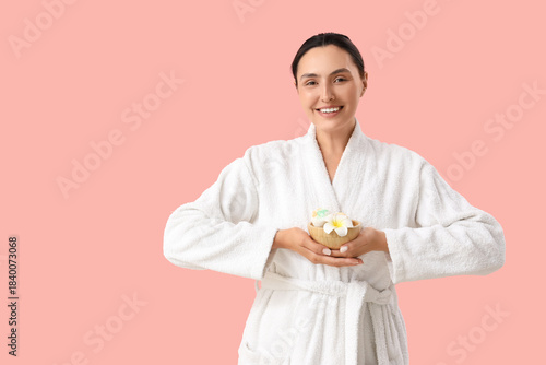 Young woman with bath bombs...
