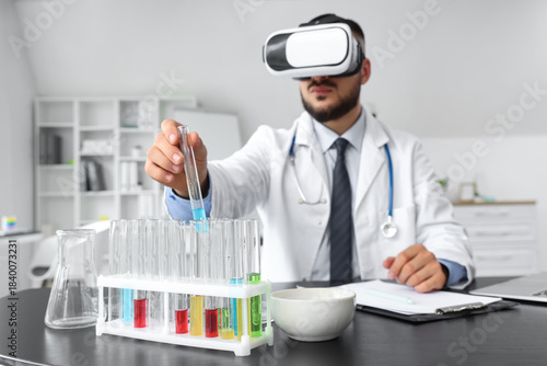 Male doctor in VR glasses w...