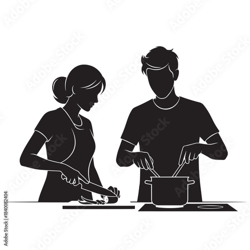 Silhouette of a couple cooking together and preparing a meal in the kitchen.