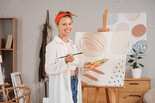 Young female artist with pa...