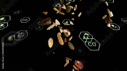 Top-edge release sending falling seed and nut bits rotating through green hex icons showing impact
