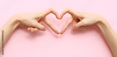 Female hands showing heart ...