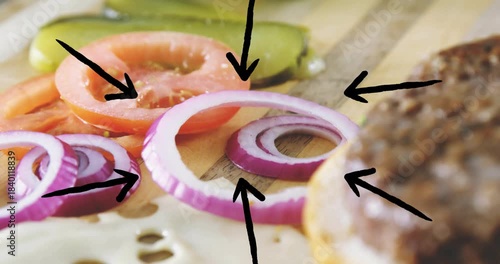Burger being animated camera shifting right, bun entering, settling, arrows highlighting toppings