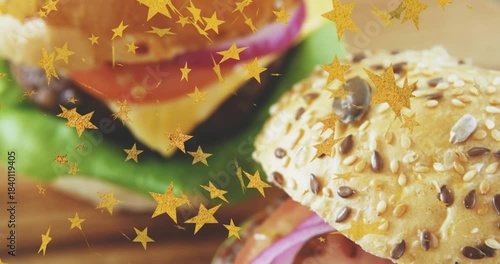 Gold stars sparking pull, camera pulling back, panning, revealing seeded bun patty showing sandwich