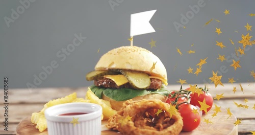 Camera pulling back, burger and sides revealing as golden stars sweeping in to highlight product