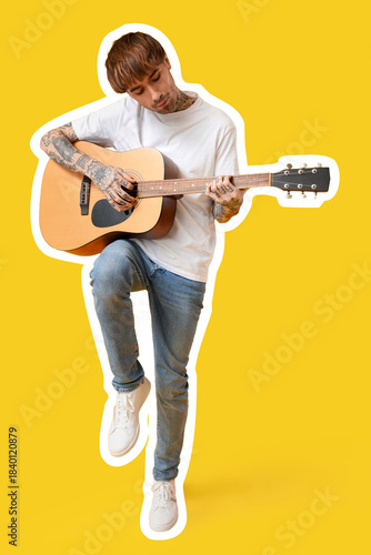 Young tattooed man playing ...
