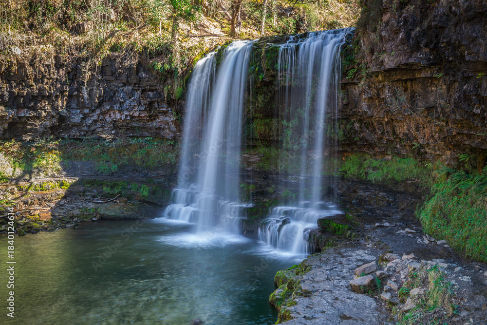 Obraz premium Sgwd yr Eira waterfall in Brecon Beacons national park, south Wales, famous for being the falls behind which you can walk
