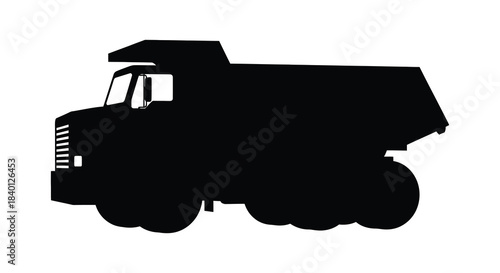 A striking black silhouette of a heavy duty dump truck showcasing industrial power silhouette