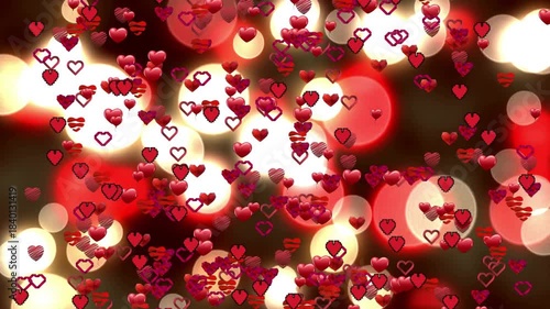 Heart particles starting from lower-left emitter, rising and spreading over warm bokeh for romance