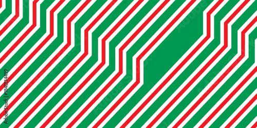 Christmas seamless pattern. Red and green diagonal stripes background. Candy cane repeating decoration wallpaper. Winter holiday lines backdrop. vector ilustration eps 10