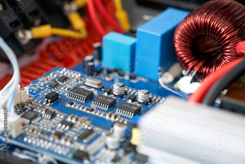 Electronic circuit board with electrical component. Close up. Selective focus.