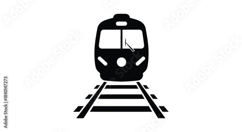 A striking black train front view atop railway tracks presented as a bold silhouette