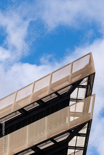 Cobblestone textures and patterned pavement reveal geometry, detail and structure that connect modern exterior architecture and design across a broader urban environment