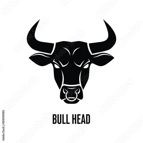 A striking black and white illustration depicts the front view of a bull s head with large horns and intense eyes