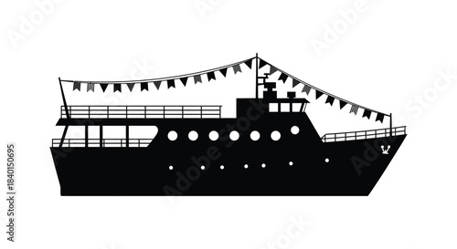 A striking black silhouette of a decorated ferry boat with bunting flags displayed beautifully silhouette