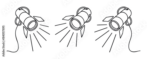 Row of three spotlights shining beams of light downwards for stage or event lighting applications in entertainment production and visual presentation settings