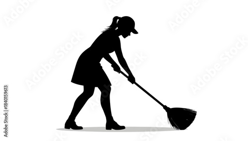 Silhouette of a woman wearing a cap sweeping the floor with a broom