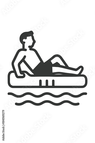 Man relaxing on an inflatable floating mattress in the water during summer vacation